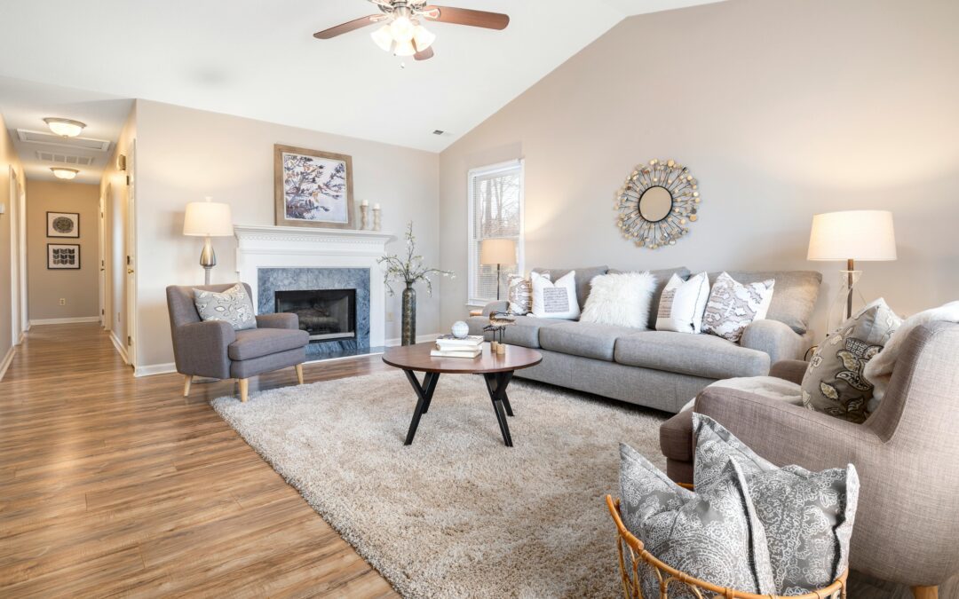 A cozy living room with a elegant white couches.